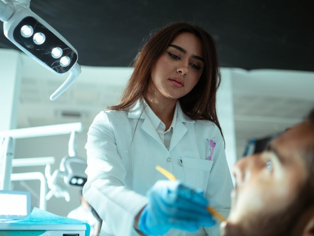 A female dentist examining a patient